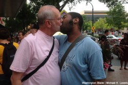 William Poe and Chris Corbin kiss outside the downtown Silver Spring Chick-fil-A (Blade photo by Michael K. Lavers)