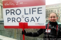 GOProud staffer Holly Parker stands outside the Archives Metro station in D.C. on Friday in support of the March for Life. (Washington Blade photo by Michael K. Lavers)