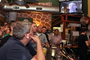 Attendees listen to gay sex columnist Dan Savage give a satellite speech at Duplex Diner for the Trevor Project. (Blade photo by Michael Key) 