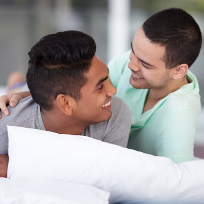 young happy gay couple relaxing, gay news, Washington Blade