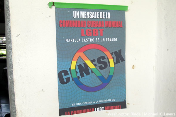 A poster at the home of Nelson Gandulla Díaz, president of the Cuban Foundation for LGBTI Rights, that describes Mariela Castro Espín, daughter of Cuban President Raúl Castro, as a "fraud." (Washington Blade photo by Michael K. Lavers)