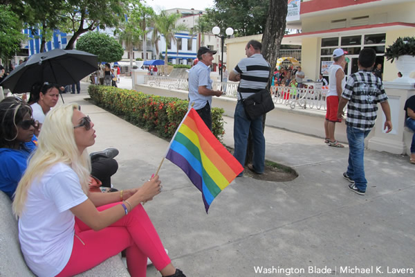 Cristal, a transgender woman from Havana who is a member of the Trans Network of Cuba, which is affiliated with the National Center for Sexual Education, holds a Pride flag in Las Tunas, Cuba, on May 16, 2015, during the commemorations of the International Day Against Homophobia and Transphobia. (Washington Blade photo by Michael K. Lavers)