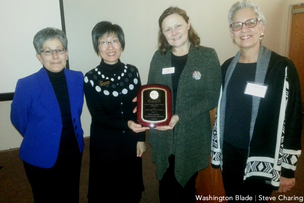 PFLAG chapter receiving Howard County Human Rights Commission 2015 Human Rights Award. From left: Yvette Lopez (Human Rights Commission), Cheun-Chin Biana Chang (Human Rights Commission), Catherine Hyde (PFLAG) and Sue Garner (PFLAG) (Washington Blade photo by Steve Charing)