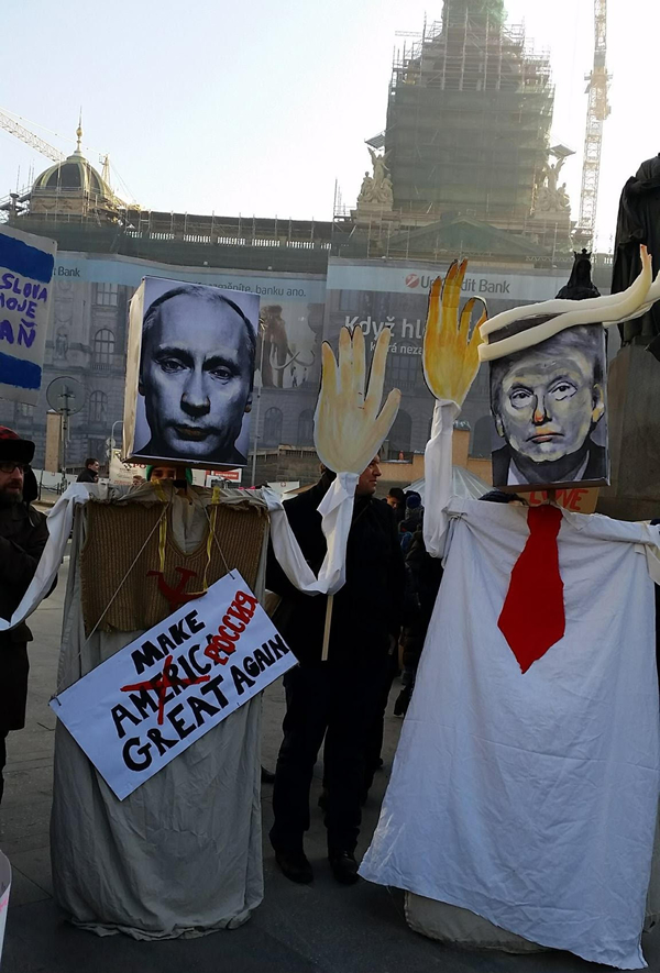 Protesters in Prague, Czech Republic, hold signs against Russian President Vladimir Putin and President Donald Trump on Jan. 21, 2017. (Photo courtesy Willem van der Bas)