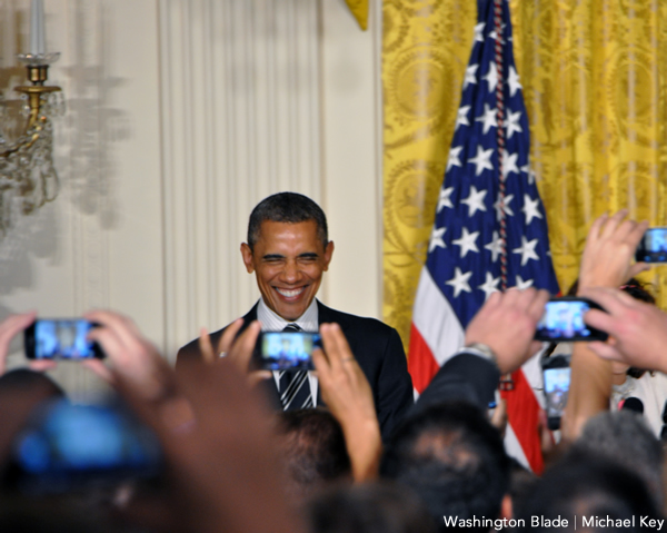 President Obama smiles for a sea of cell phone cameras during the White House Pride Reception on June 13, 2013. Obama hosted a June Pride reception each year of his presidency. (Washington Blade photo by Michael Key)